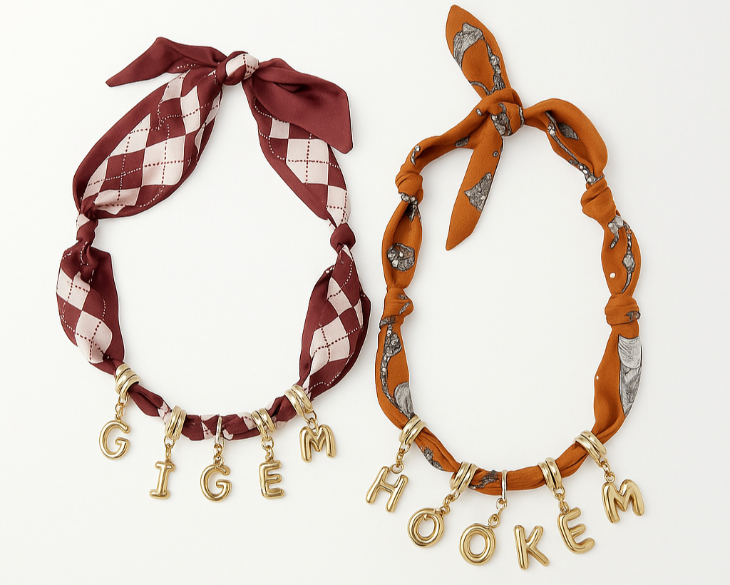 Two hair scarves with decorative ties and gold charm letters on a white background
